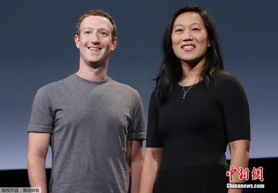 图为社交媒体“脸书”公司CEO扎克伯格及其妻子普里西拉·陈。